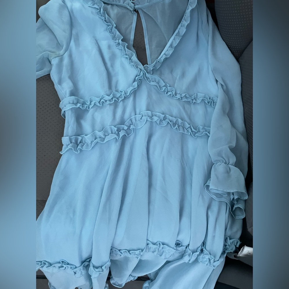 Light blue baby doll dress with v-neck and ruffles